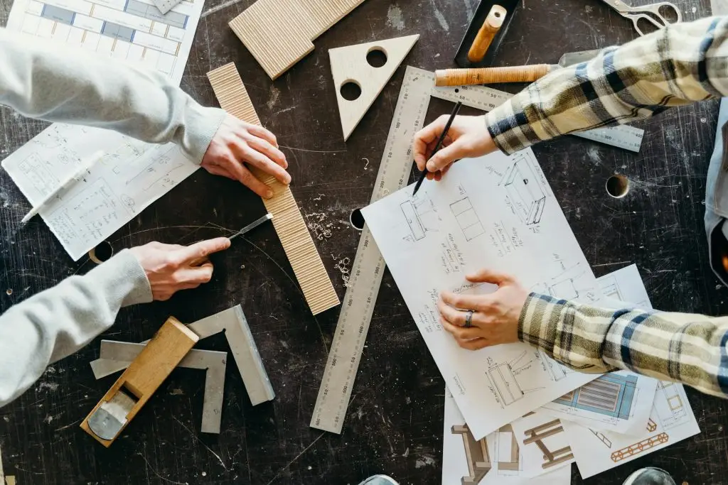 Person drafting on table.