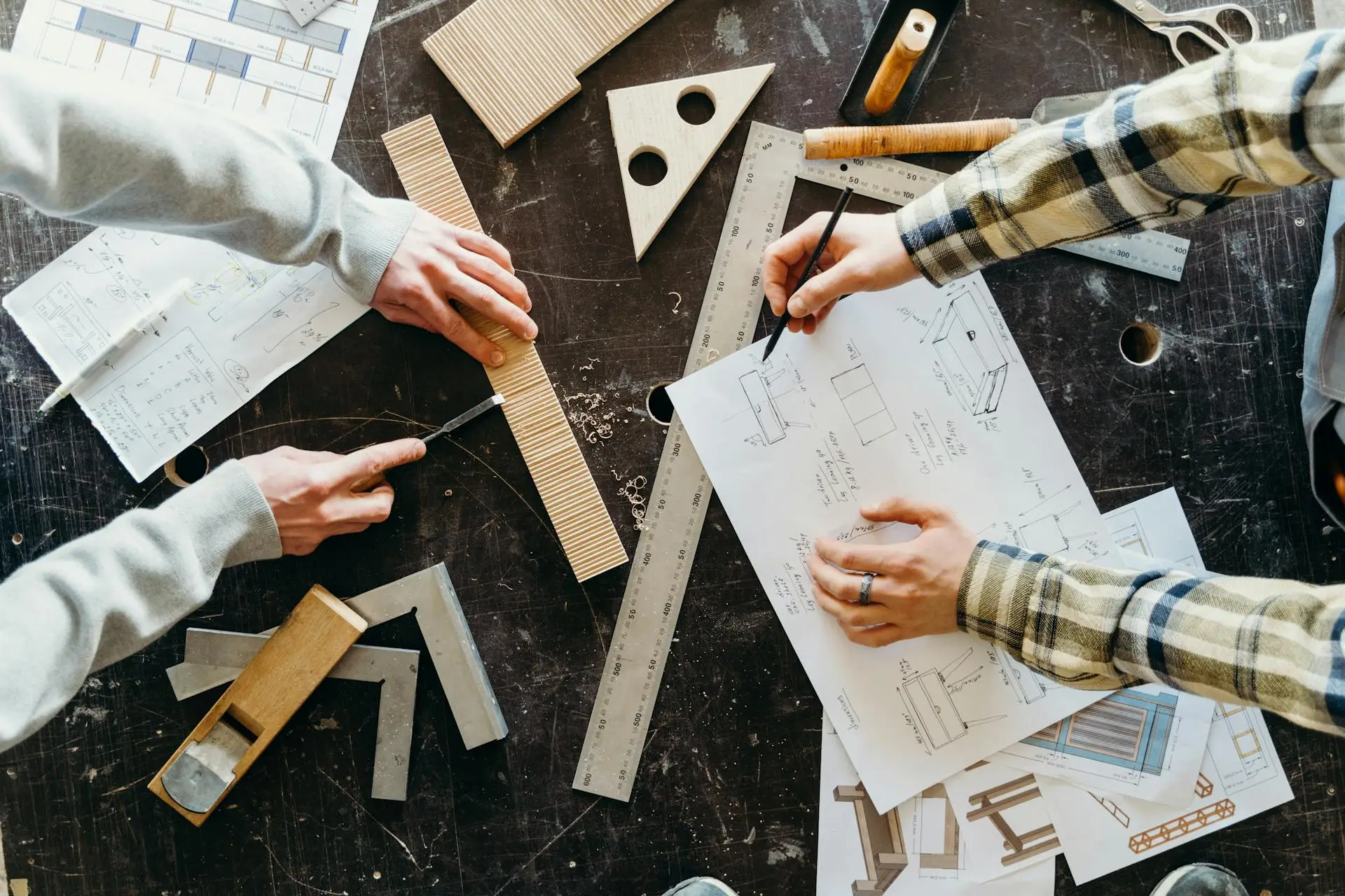 pexels-cottonbro-7484819 Person drafting on table.